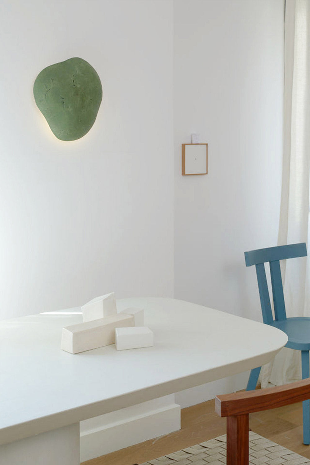 decorative green wall sconce in the living room