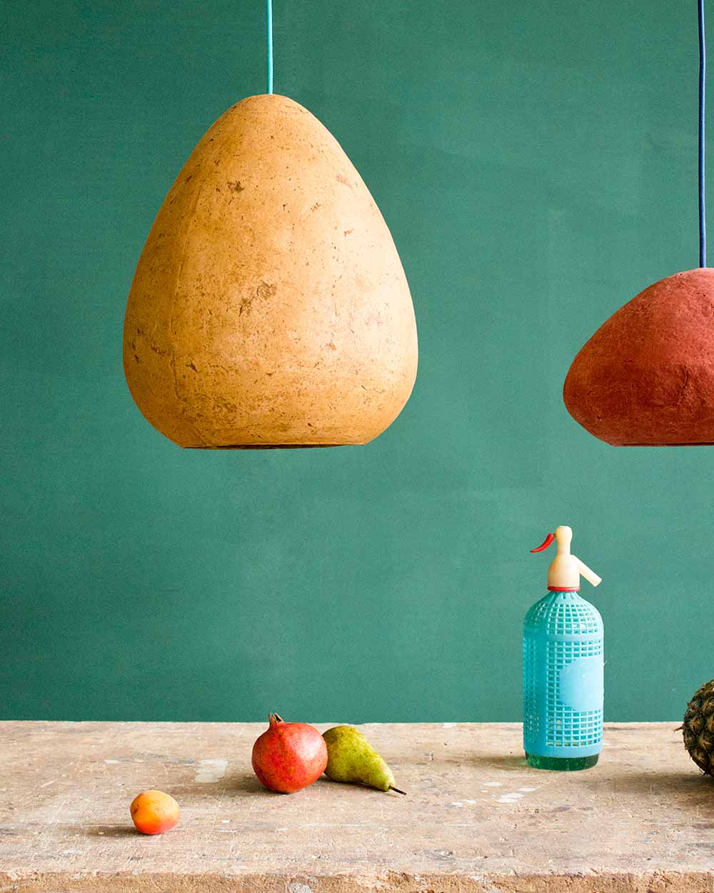 paper mache lamps above tha table