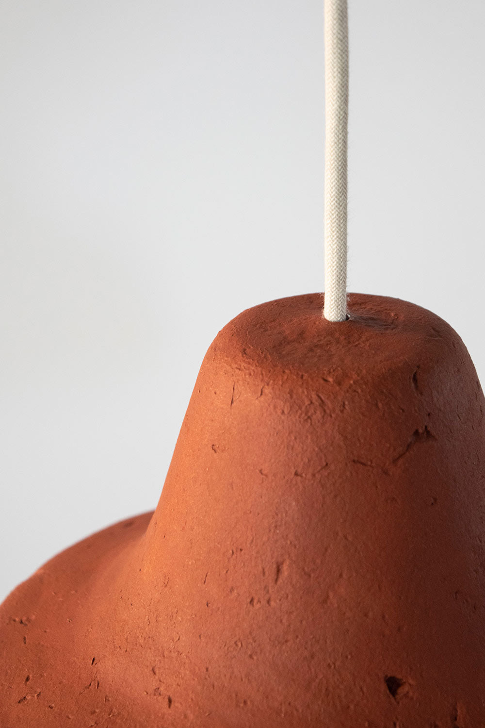 detail of the texture of orange ceiling lamp classica made of paper pulp