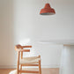 orange ceiling lamp classica above the table