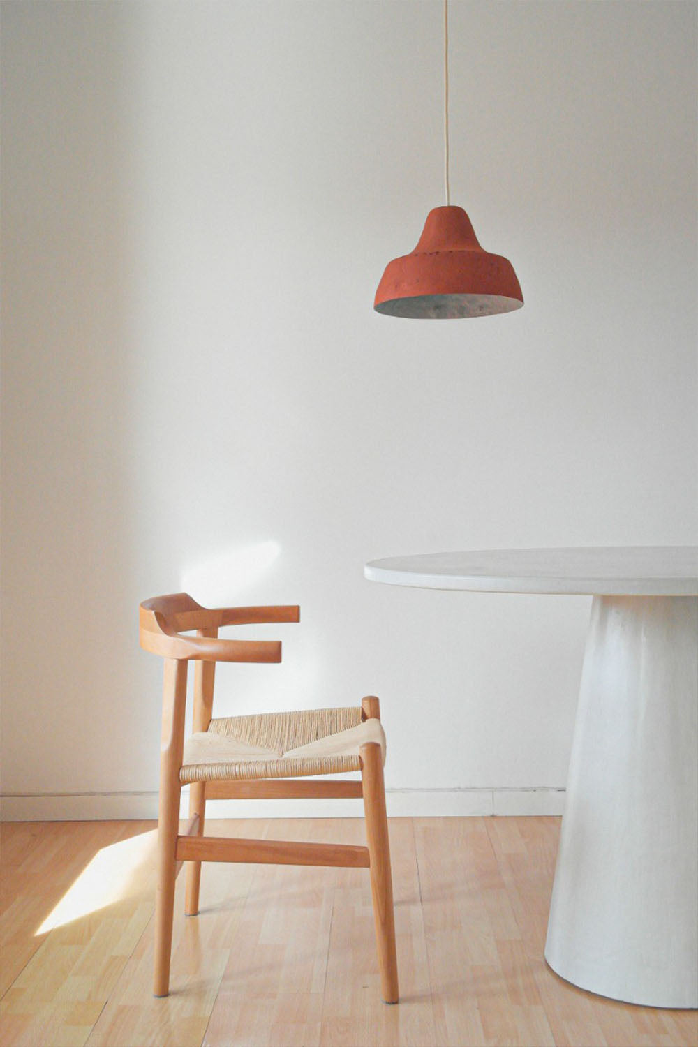 orange ceiling lamp classica above the table