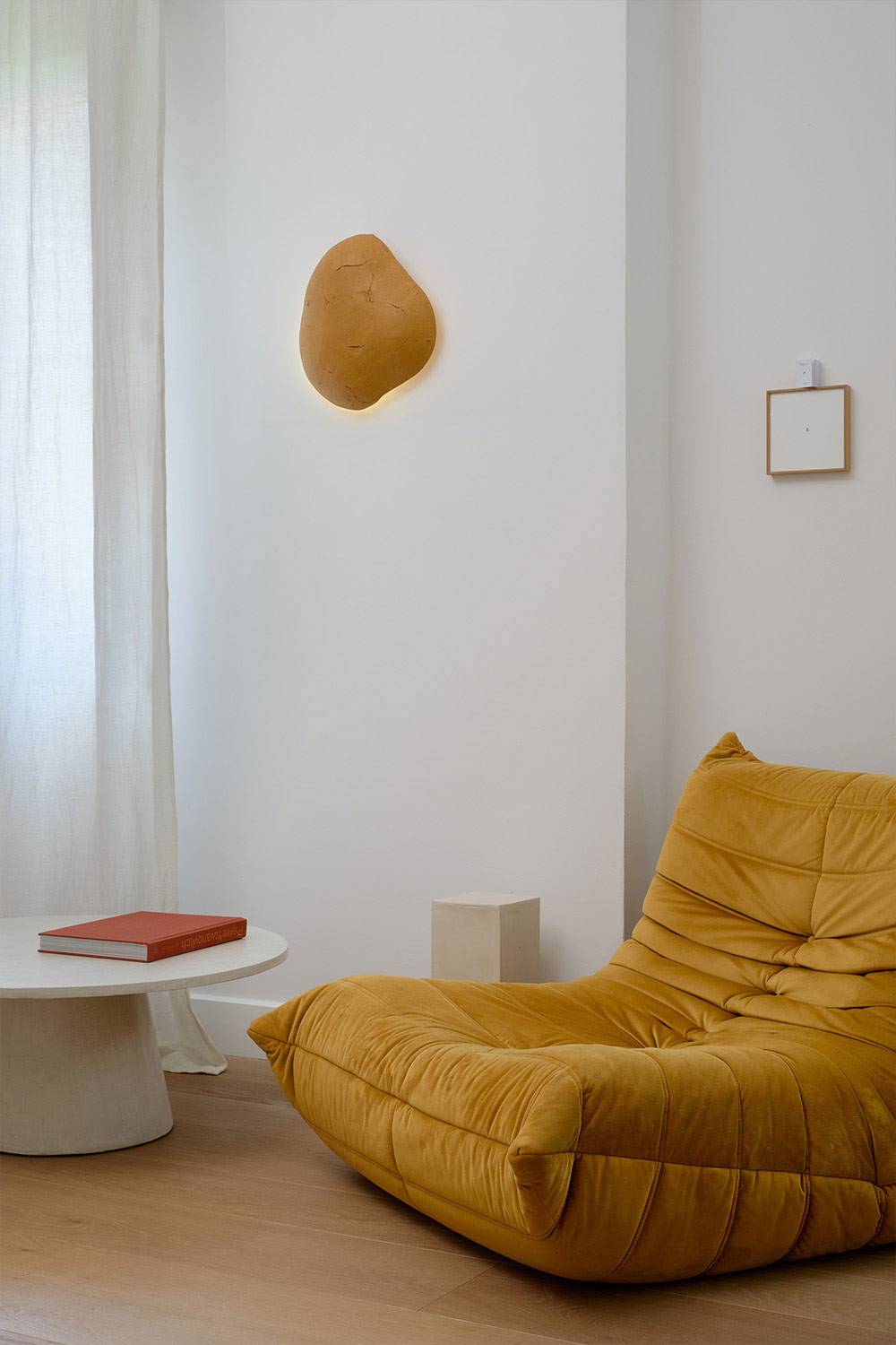 decorative yellow wall sconce in the living room
