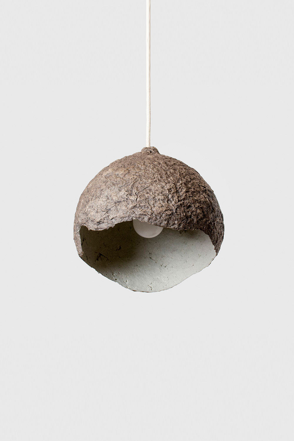 small globe lamp in brown made of paper pulp