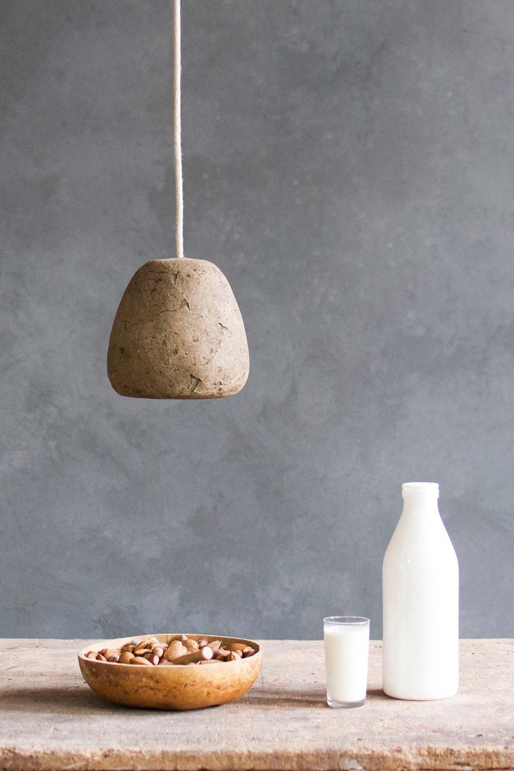 pretty small loft lamp hanging above the table