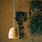 small yellow loft lamp made with paper pulp