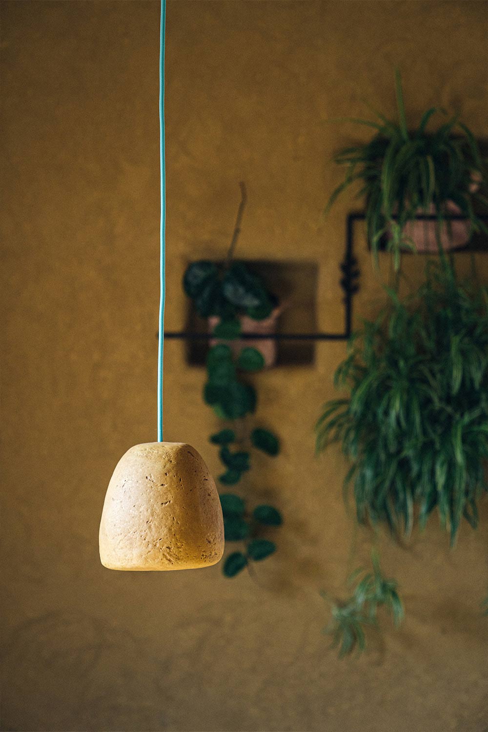 small yellow loft lamp made with paper pulp