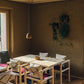 small loft lamp in yellow hanging above the table