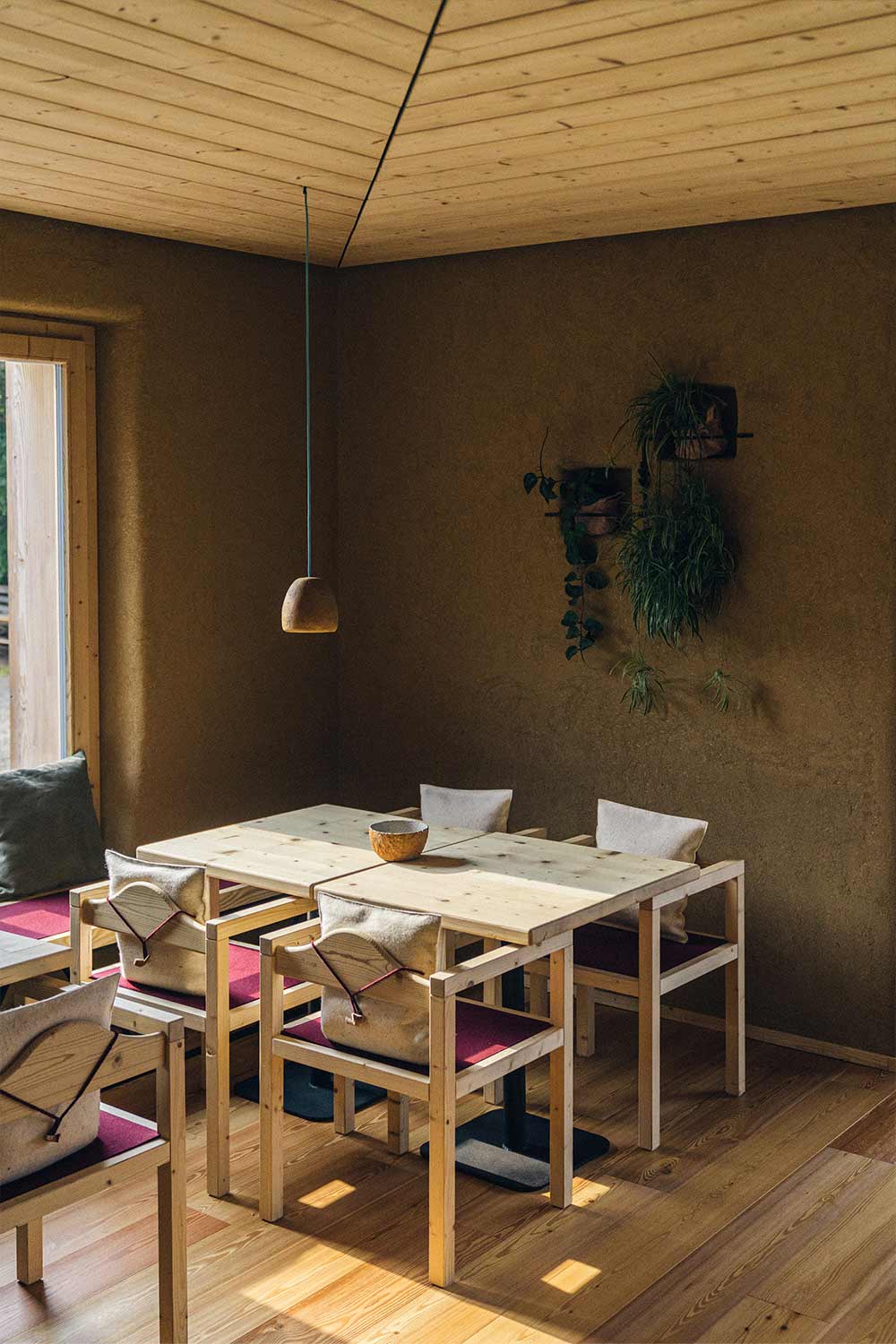 small loft lamp in yellow hanging above the table