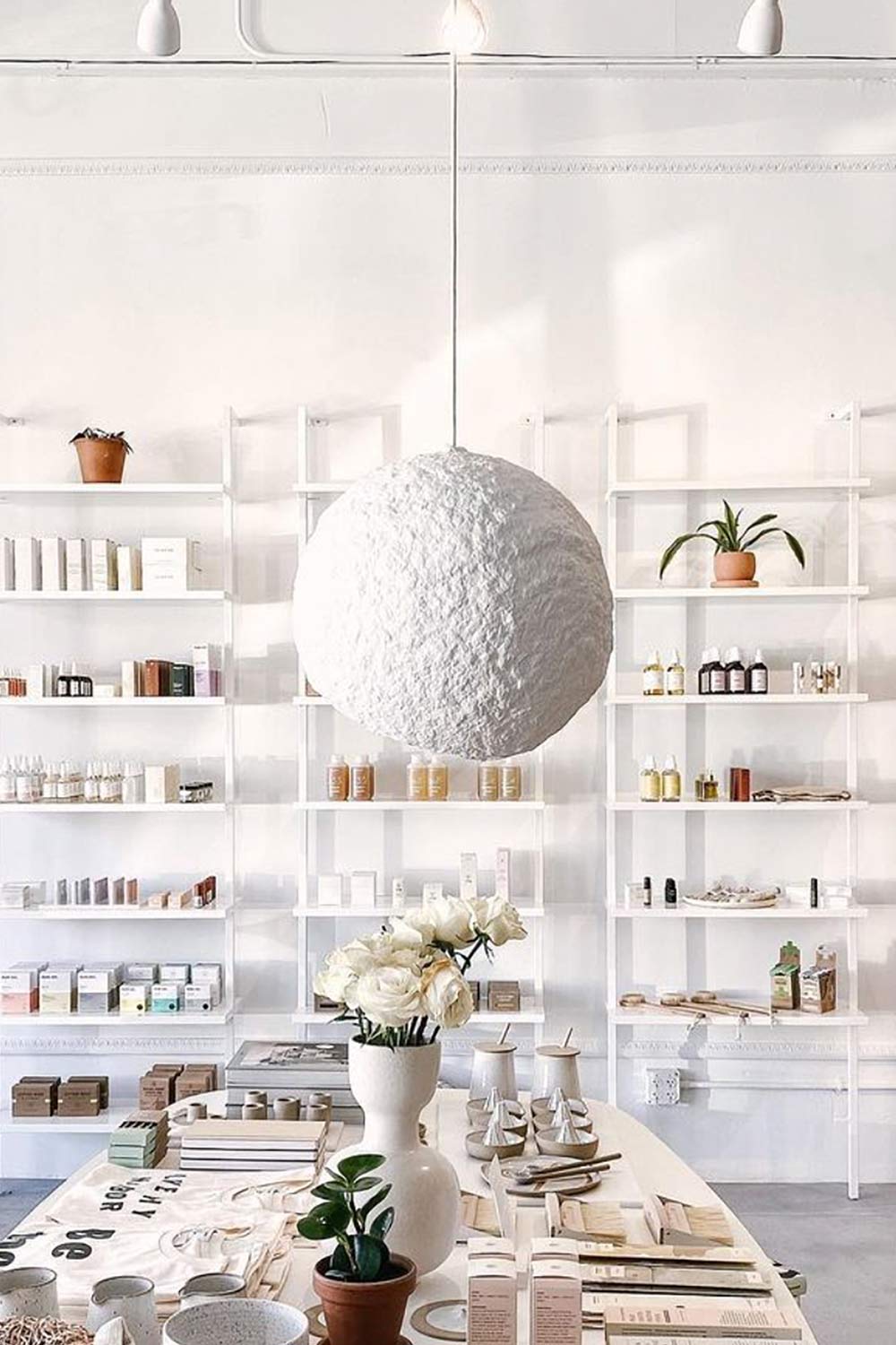 white paper lamp globe hanging above the table