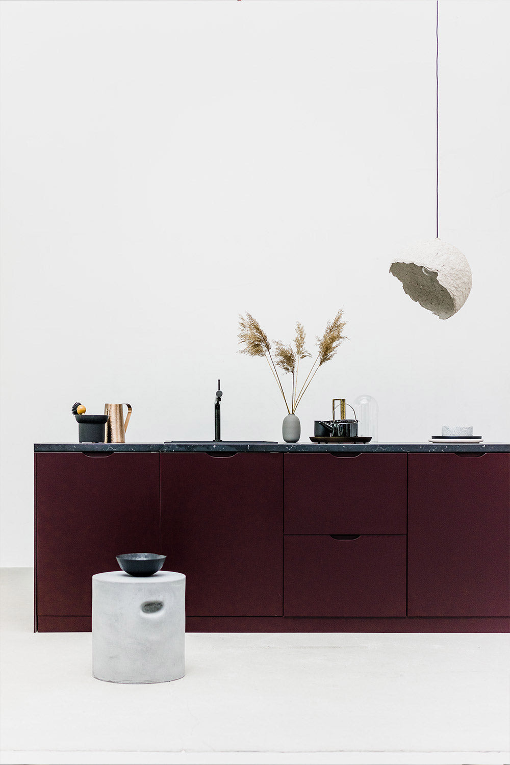 grey paper lamp globe above the kitchen island