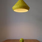 yellow paper mache lamp in the dining room