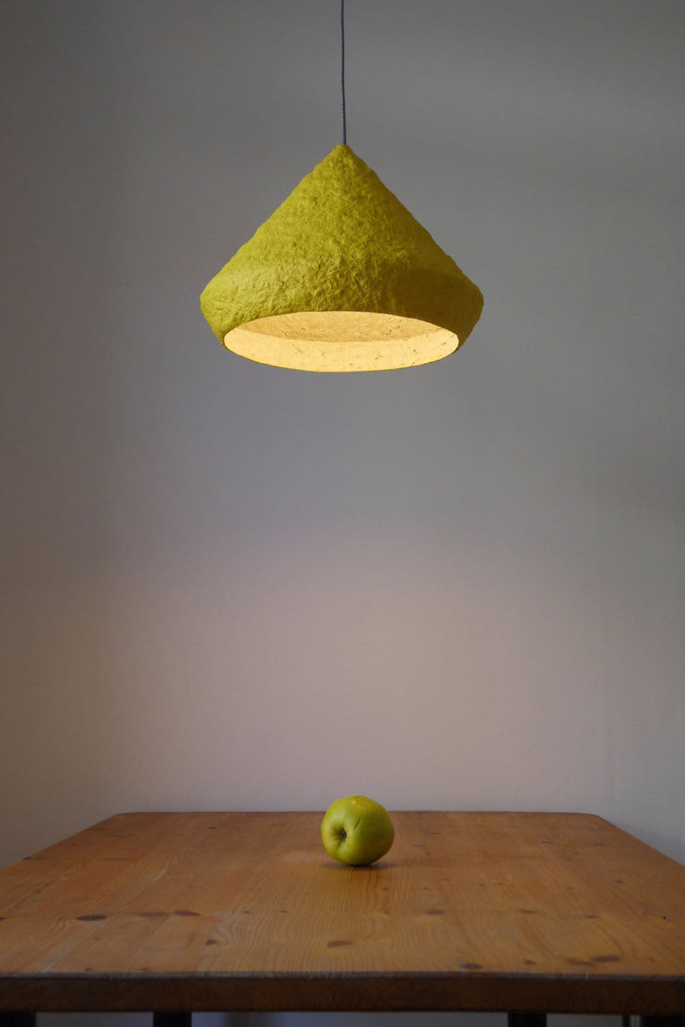 yellow paper mache lamp in the dining room