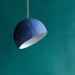 blue paper mache lamp pluto above the kitchen table 