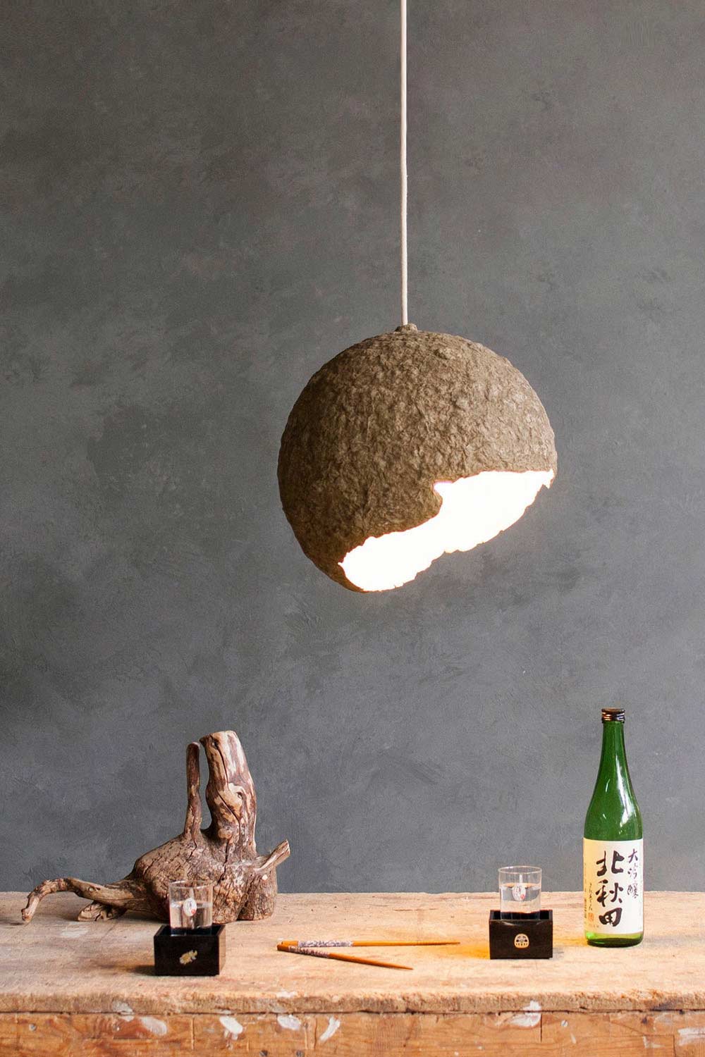 green paper mache light shade in the kitchen