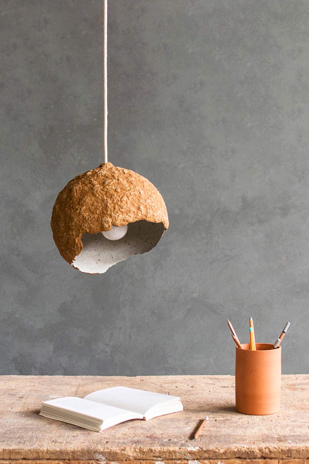 paper mache planet lamp above the table