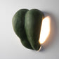 green sconce lamp made of paper mache